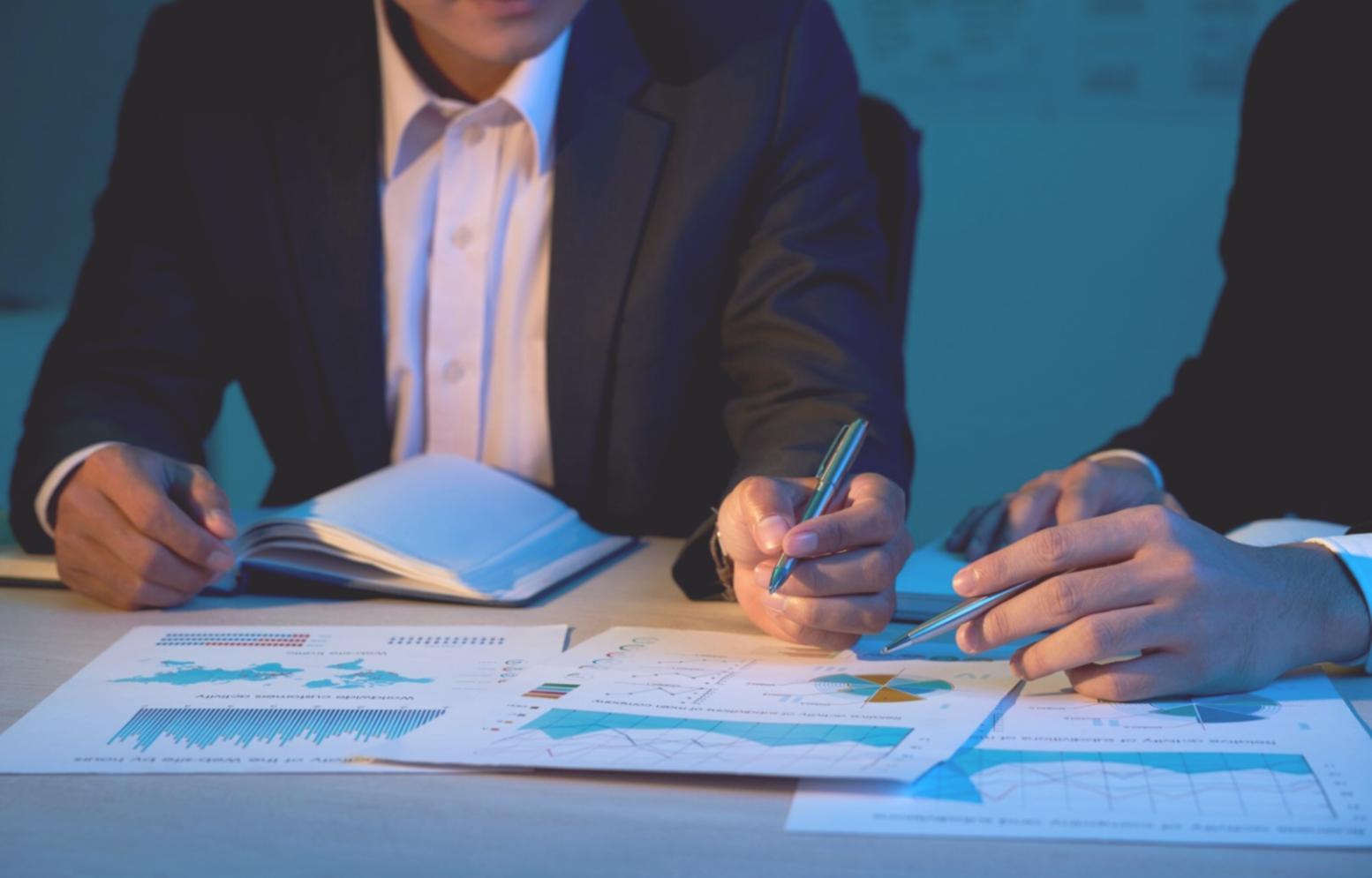 Small group discussion during financial workshop with participants sharing experiences and insights